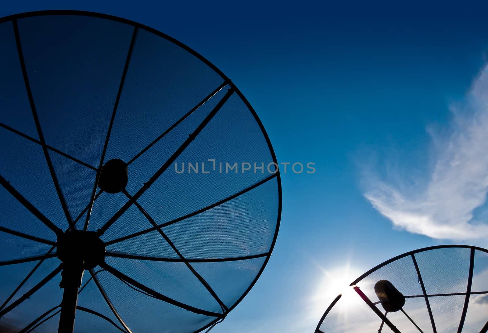 Two satellite dish with blue sky and cloud sunset time