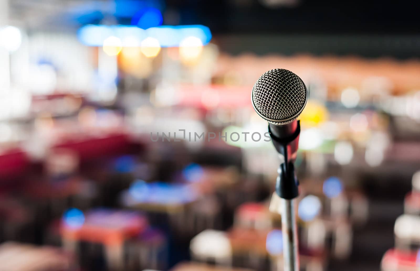 Microphone on stage in club with bokeh background