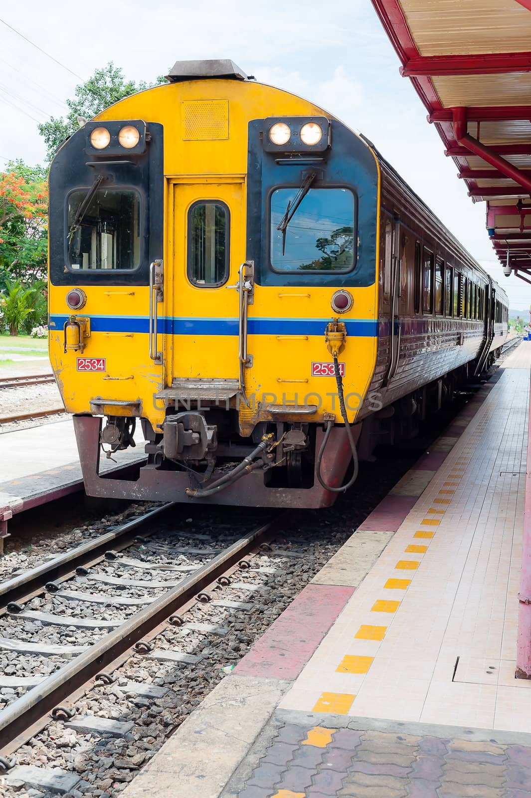 Thai yellow train in station  by moggara12