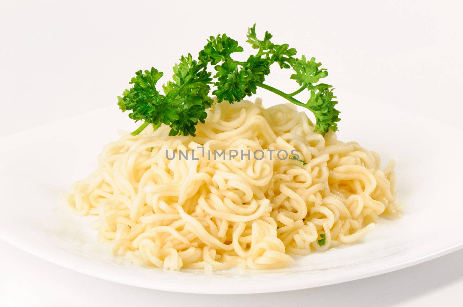 noodles on a plate on white background
