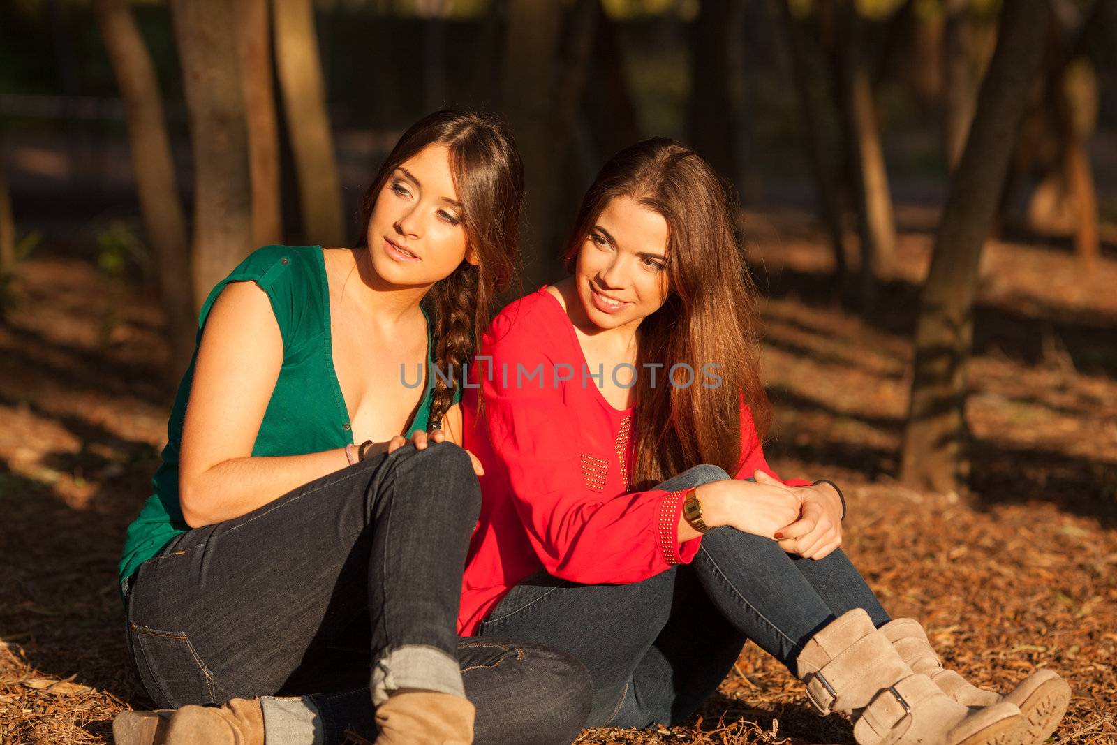 young girlfriends playing and having fun on a park