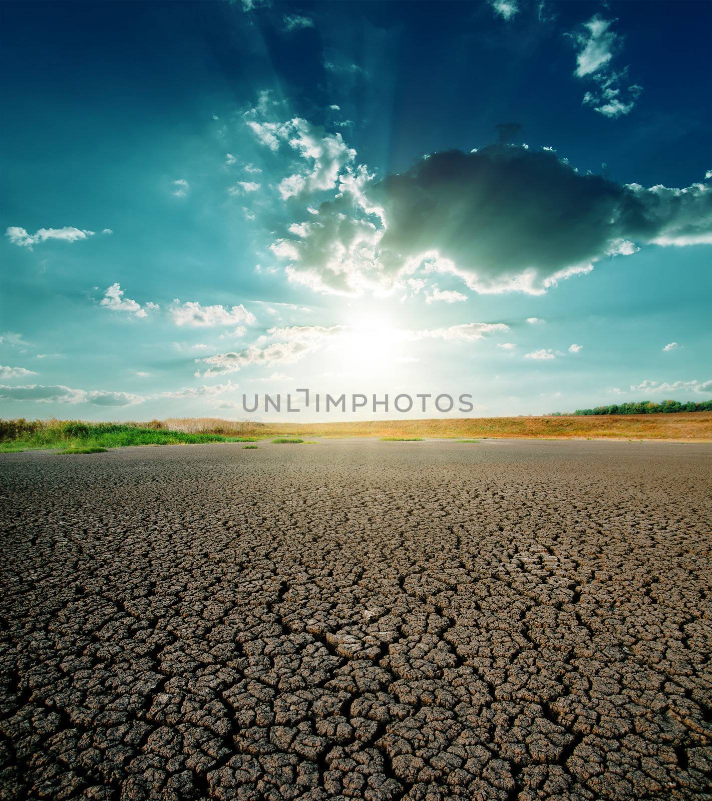 drought land and dramatic sunset by mycola