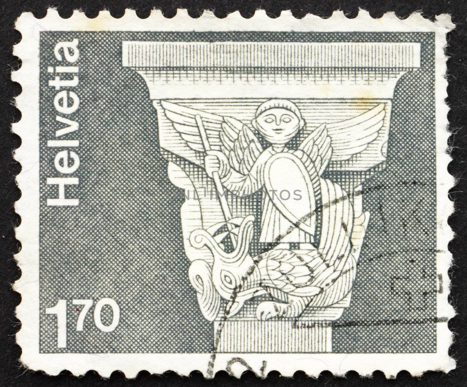 SWITZERLAND - CIRCA 1973: a stamp printed in the Switzerland shows Romanesque Capital, St. George and Dragon, St. Jean Baptiste, Grandson, Switzerland, circa 1973