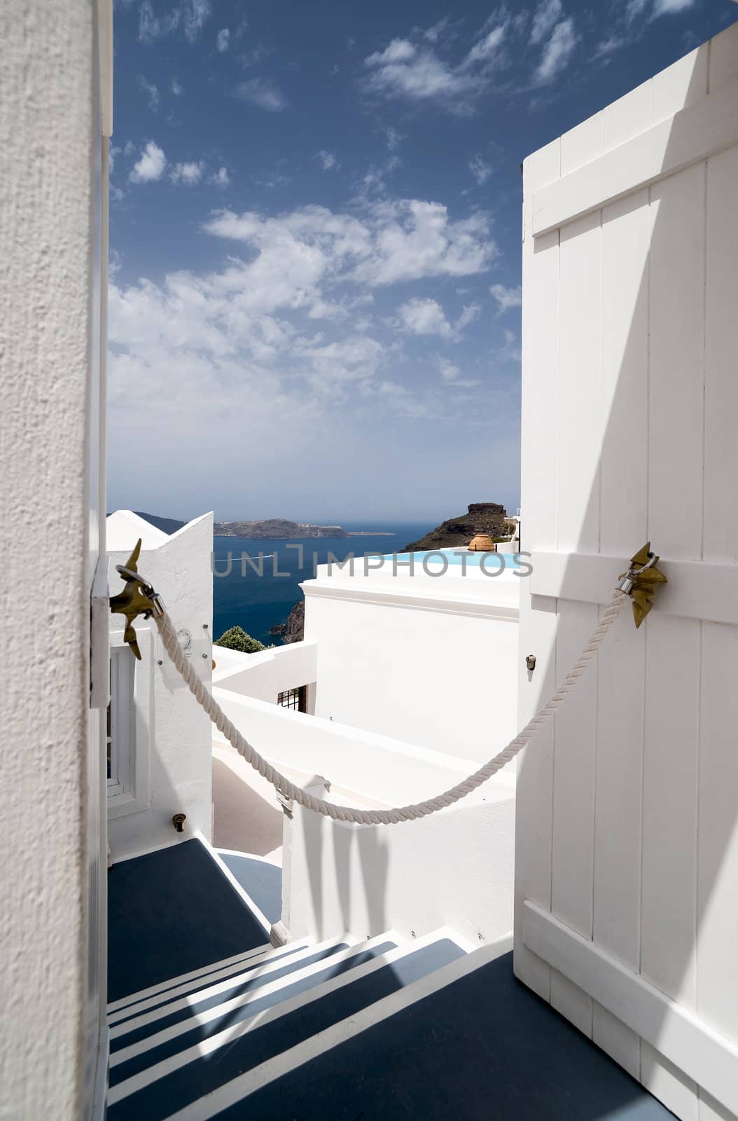 Santorini Caldera view trough the open door by mulden