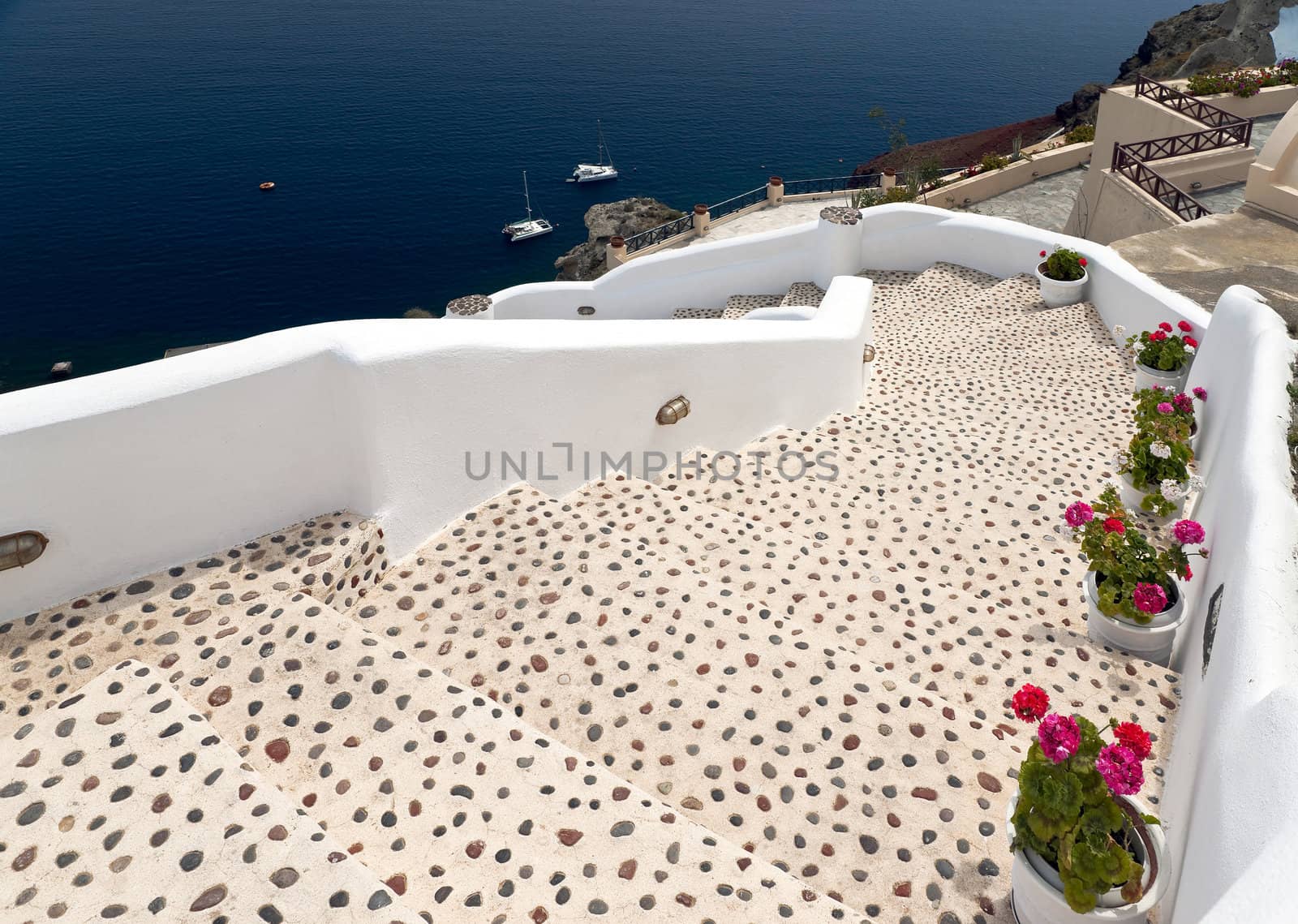 Sea view in Santorini island with leopard staircase to the buildings on the cliff