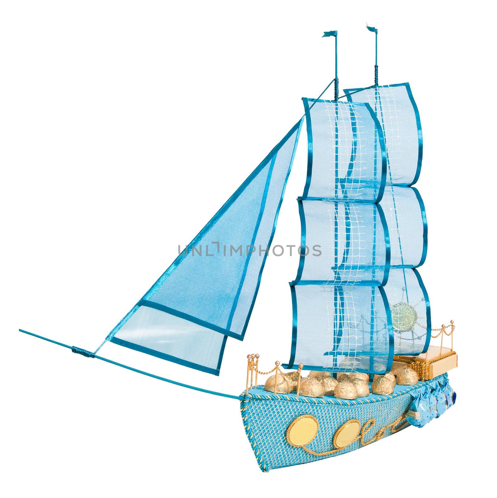 gift in form layout sailing ship decorated with candy isolated on white