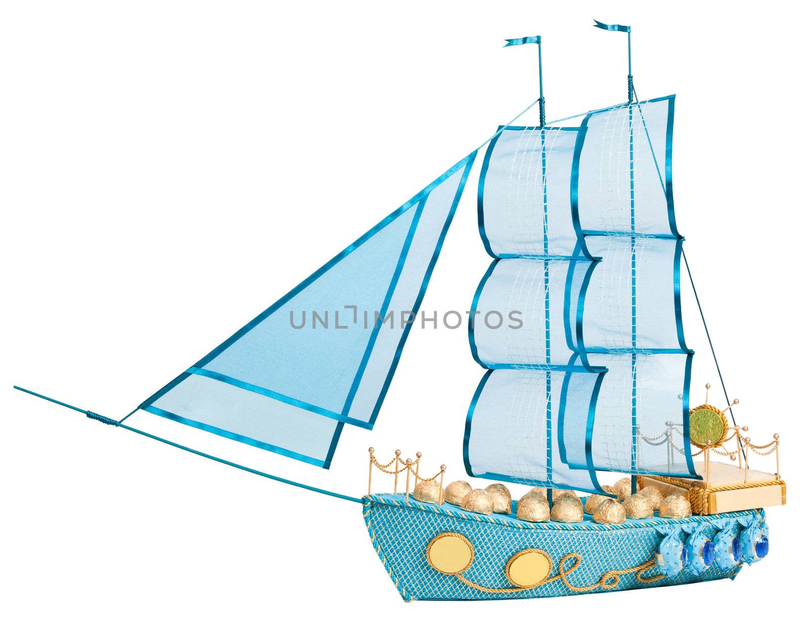 gift in form layout sailing ship decorated with candy isolated on white