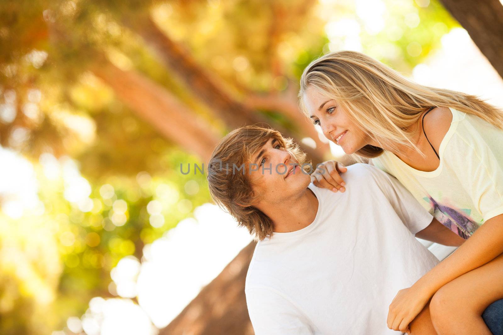 young beautiful couple enjoying a day on the park by Lcrespi