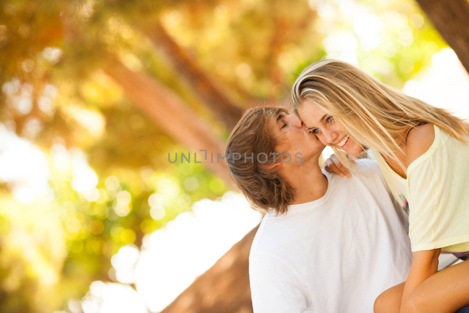 young beautiful couple enjoying a day on the park on summer