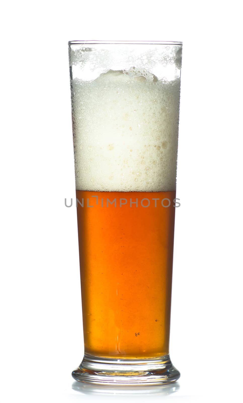 beer glass full of cold lager. Isolated.