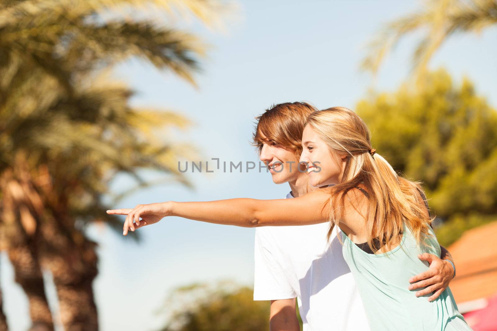 Young romantic beautiful couple enjoying on a walkside  by Lcrespi