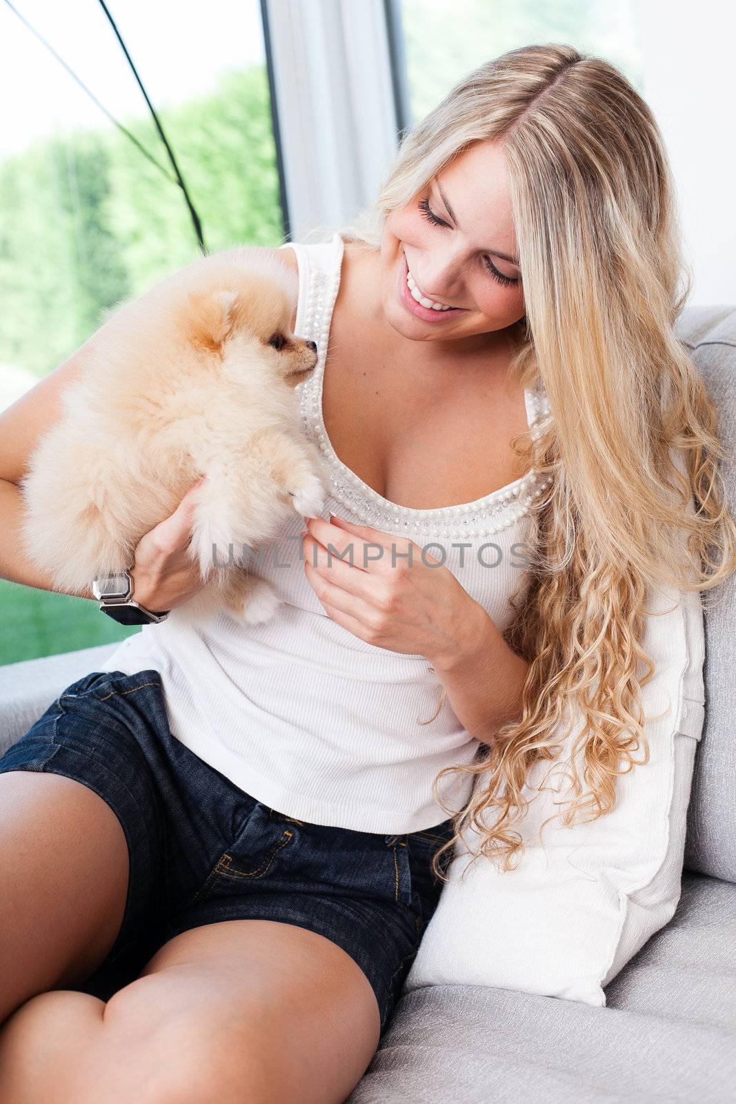 young woman playing with her tinny dog by Lcrespi