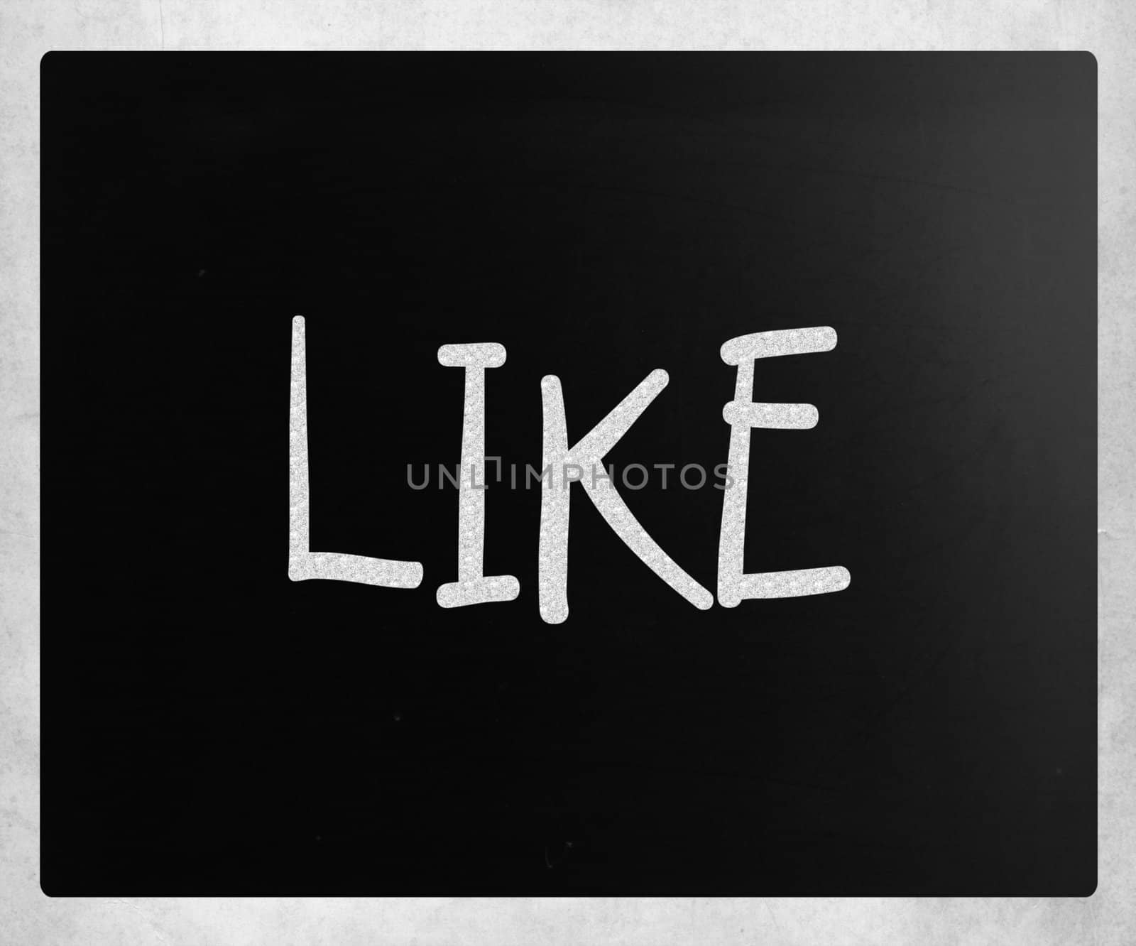 "Like" handwritten with white chalk on a blackboard.