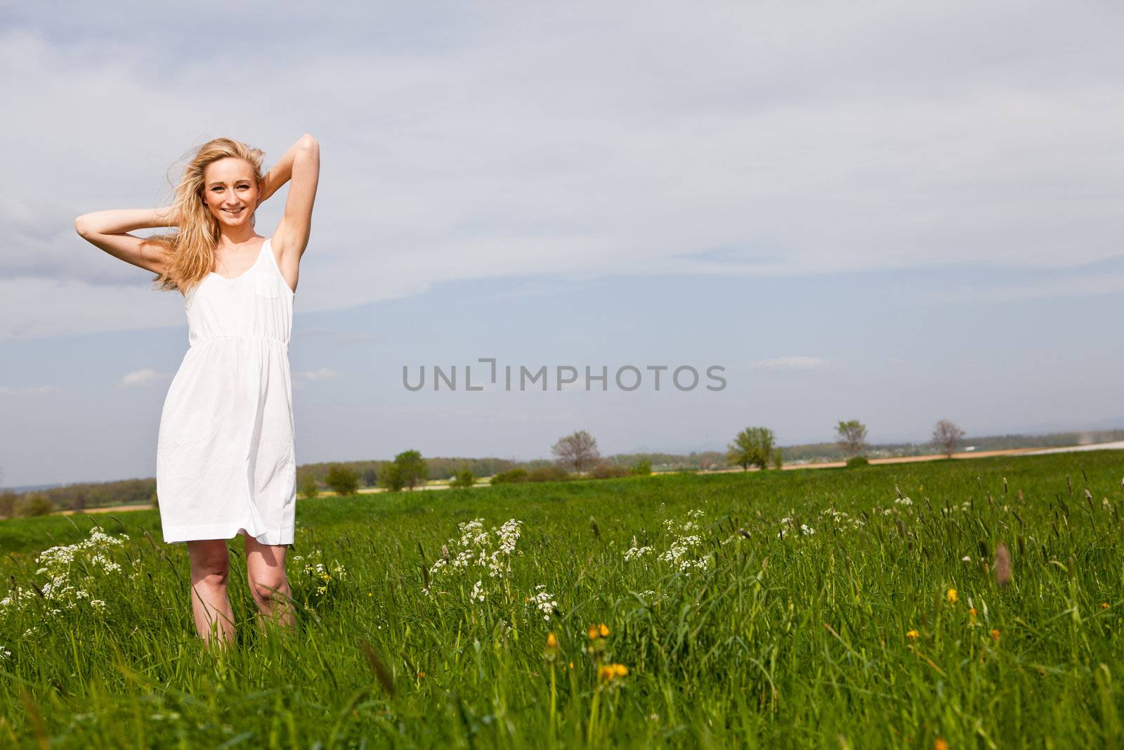 beautiful blonde woman outdoor in summer happy by juniart