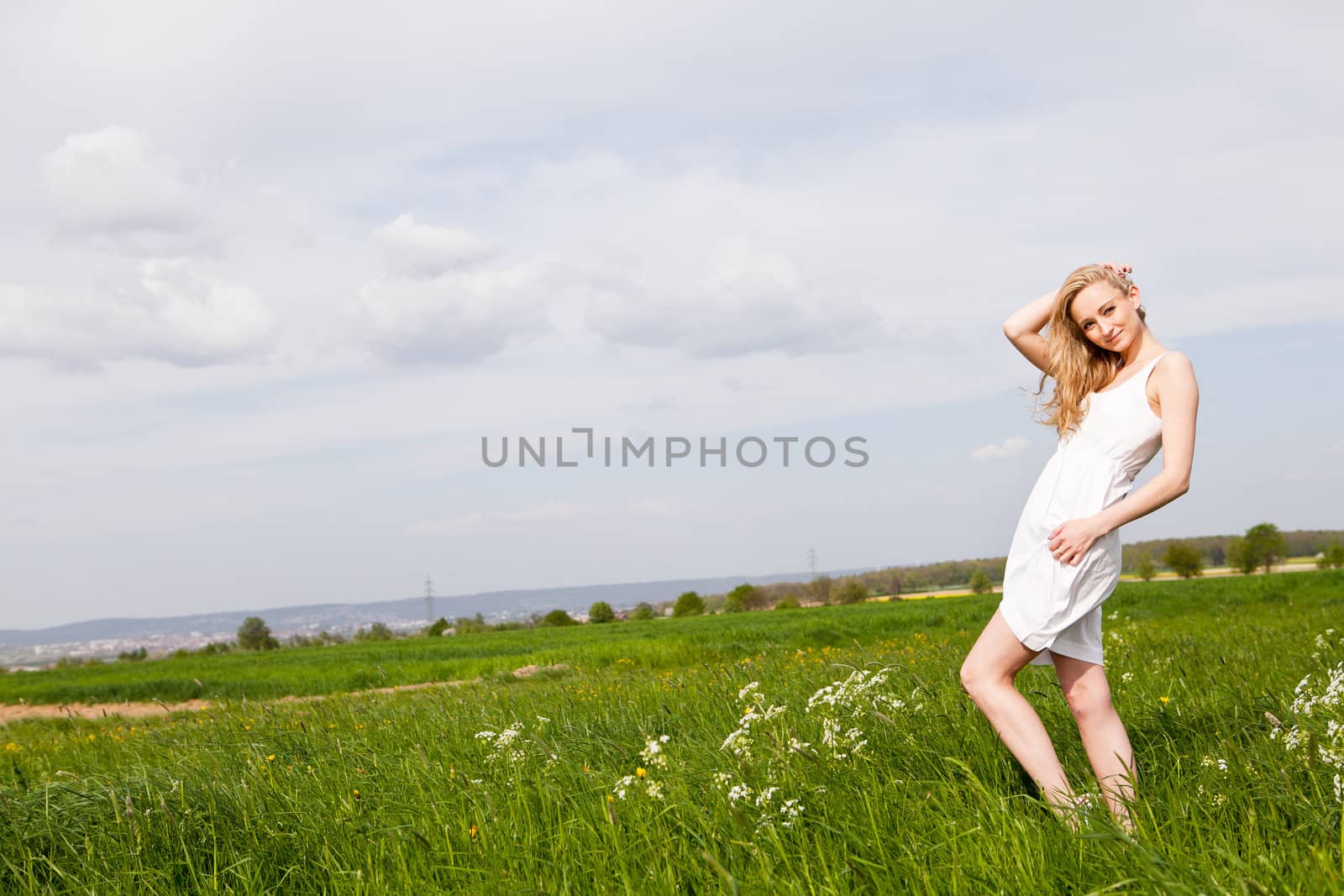 beautiful blonde woman outdoor in summer happy