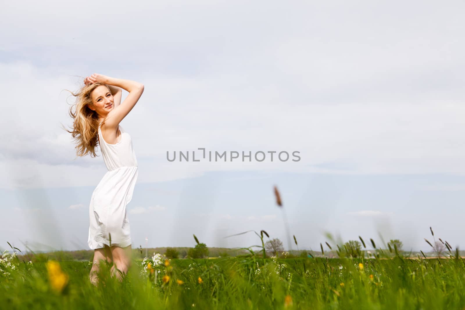 beautiful blonde woman outdoor in summer happy by juniart