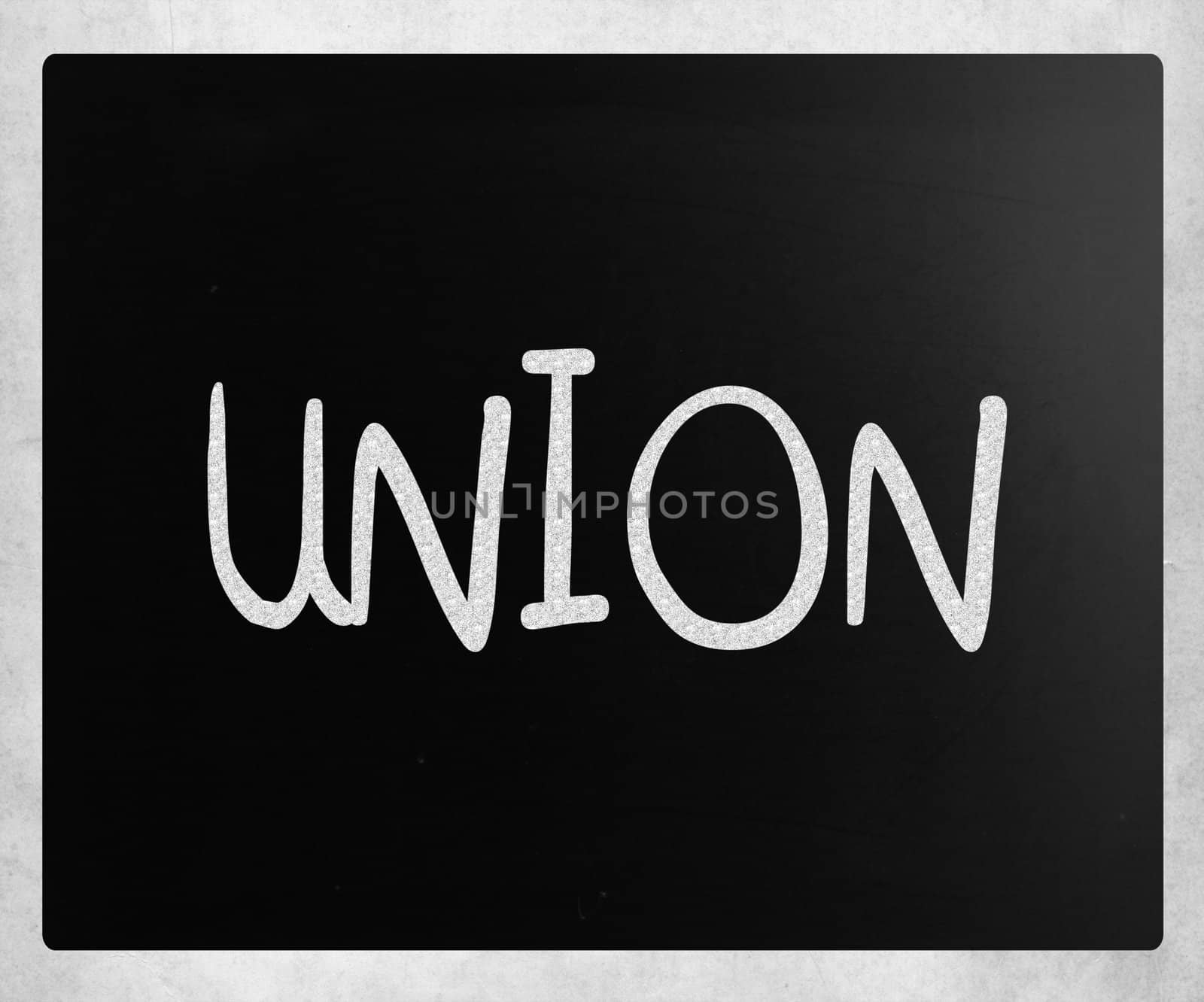 The word "Union" handwritten with white chalk on a blackboard by nenov