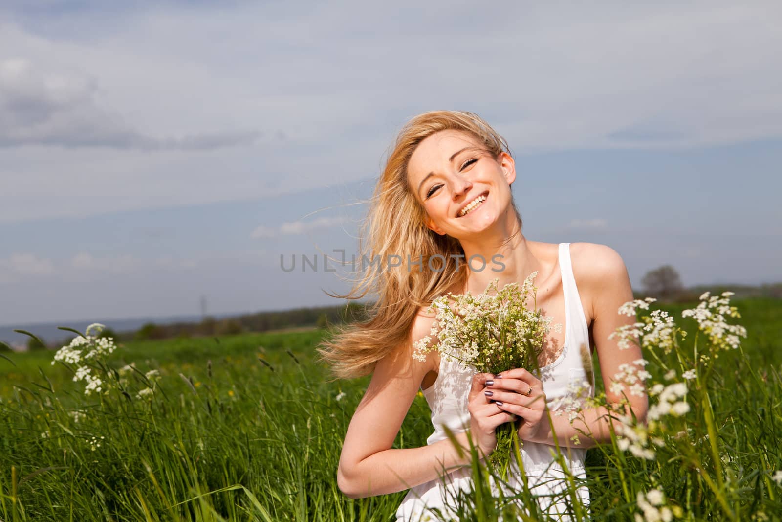 beautiful blonde woman outdoor in summer happy by juniart