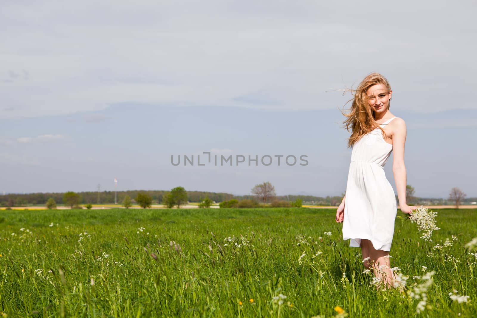 beautiful blonde woman outdoor in summer happy by juniart