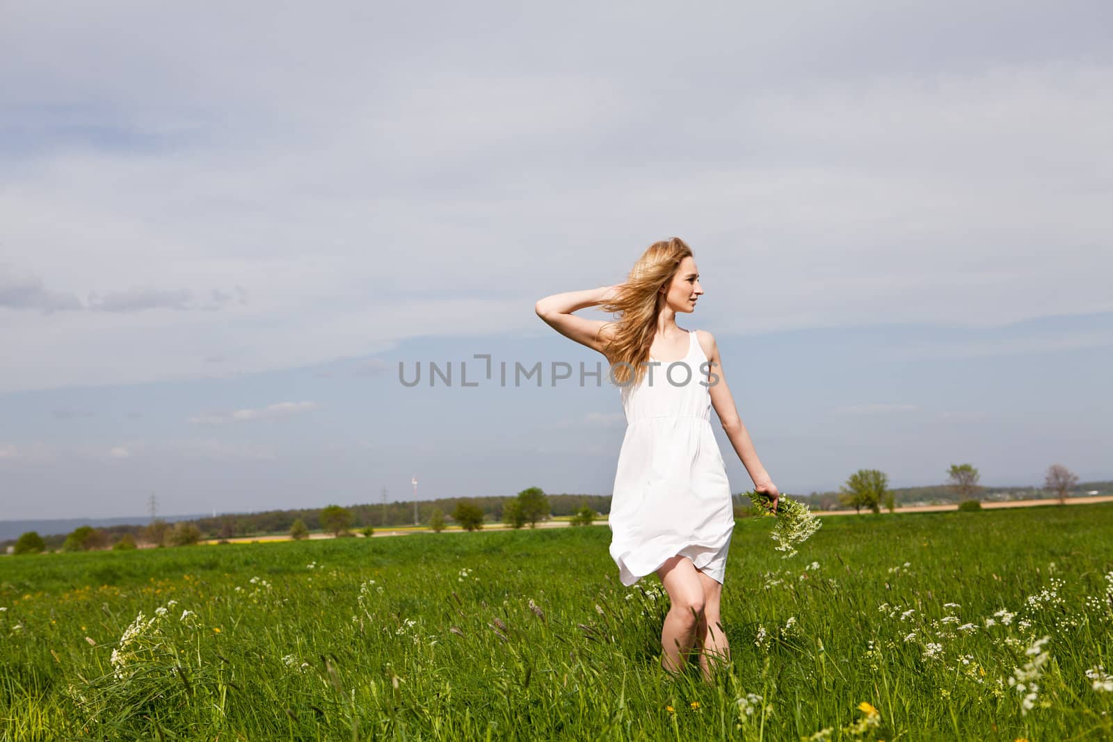 beautiful blonde woman outdoor in summer happy by juniart