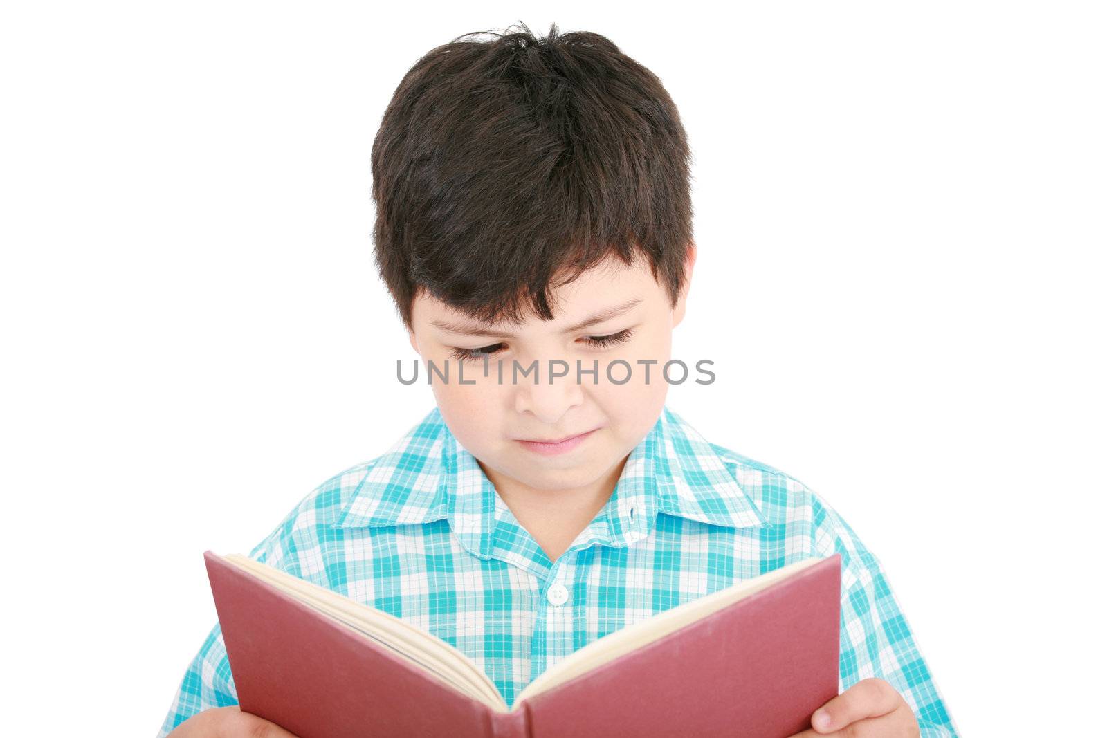 Small boy reading a book on a white background