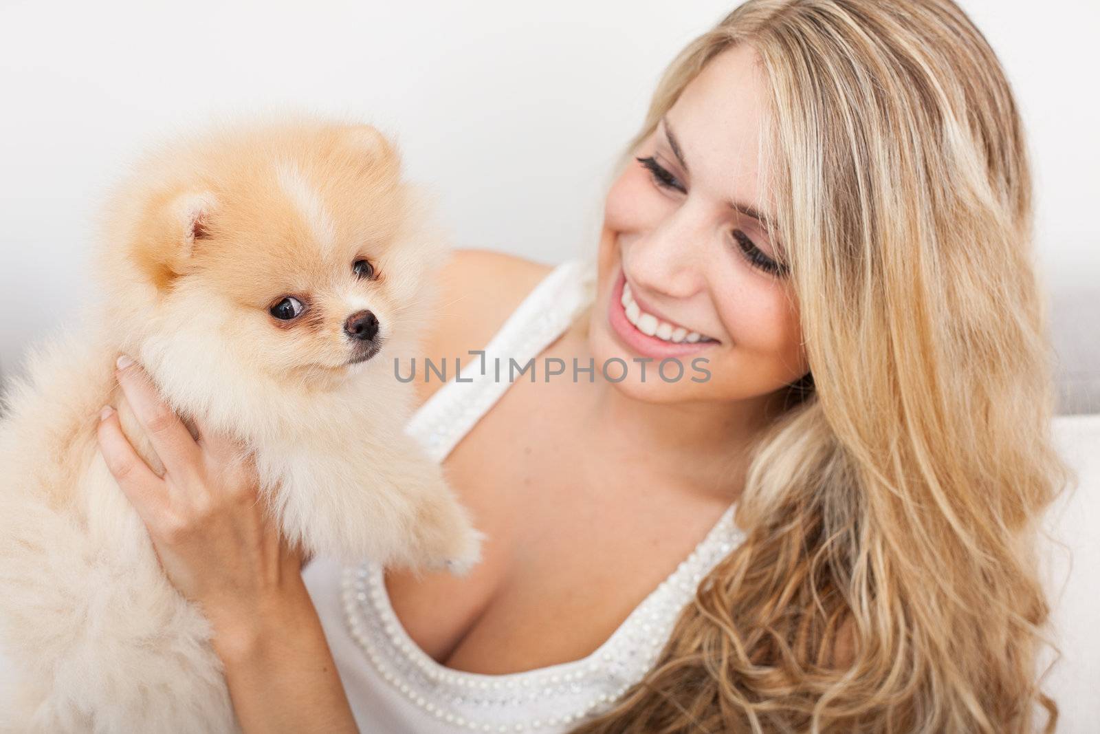 young woman playing with her tinny dog by Lcrespi