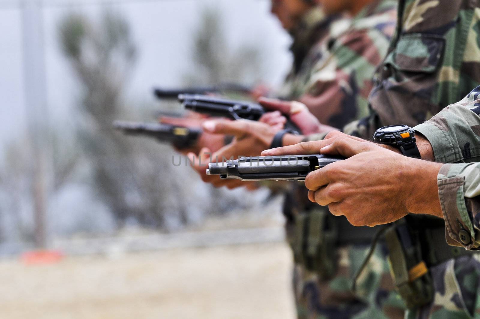 Soldier while charging a gun