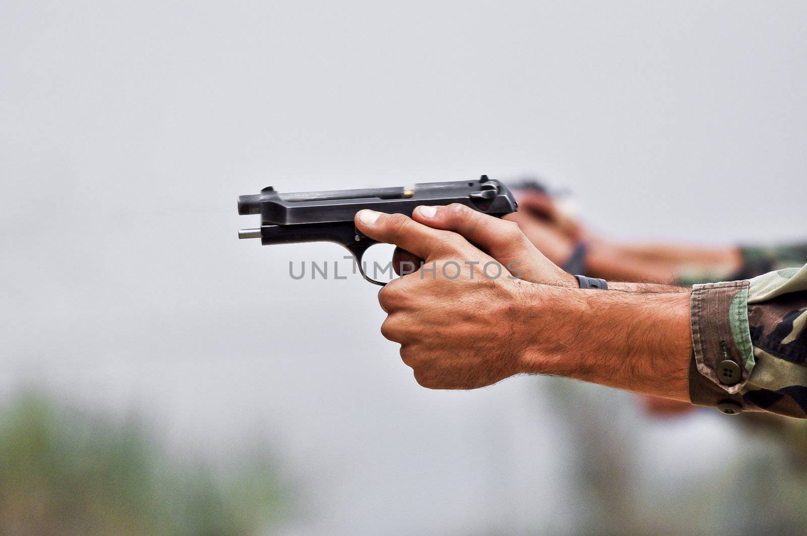 Soldier while charging a gun