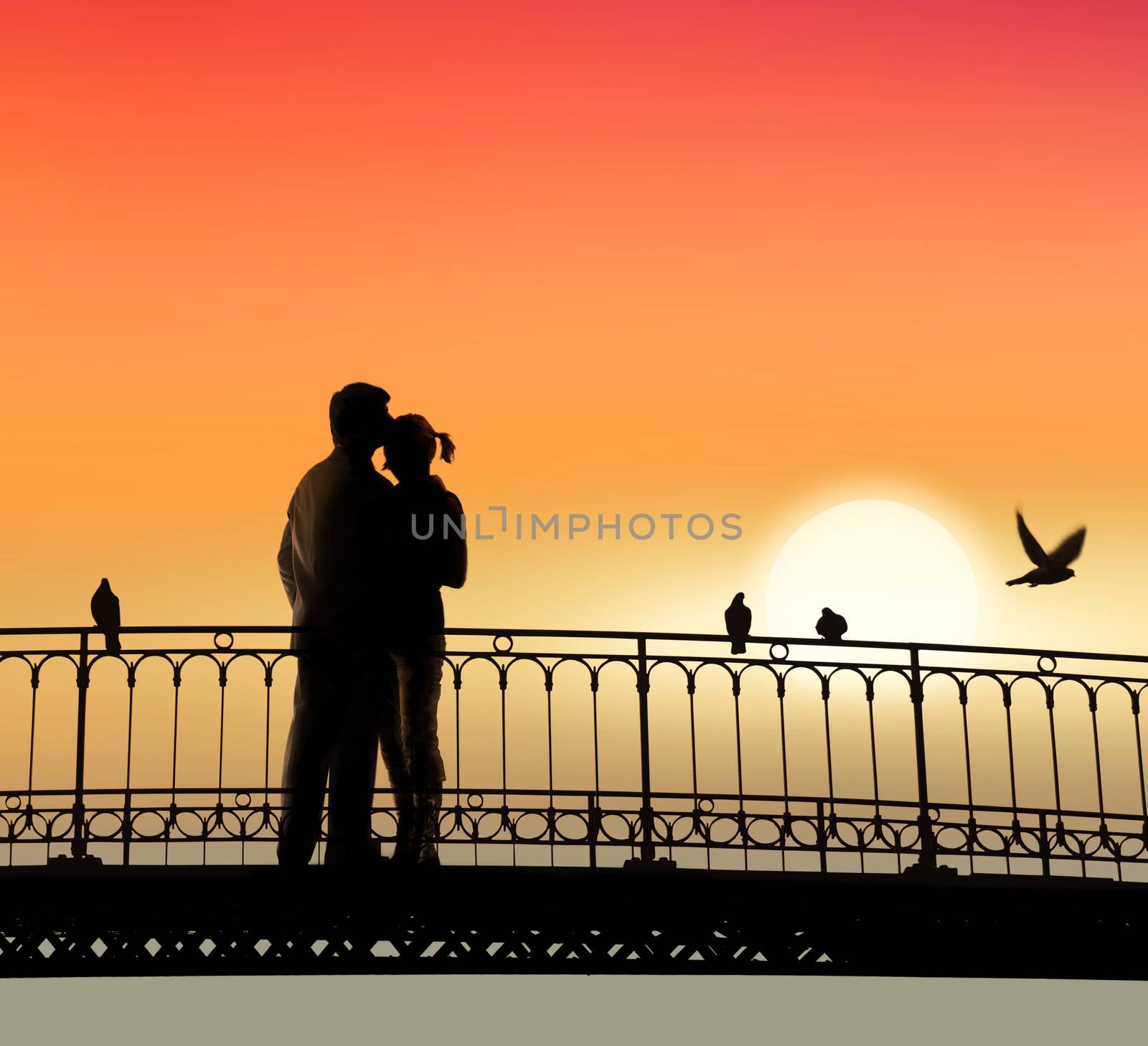 silhouette of bridge and pair of lovers on sunset background