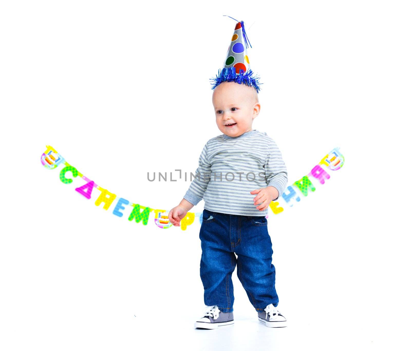 Cute funny little boy in first birthday with colored balloons. In the studio