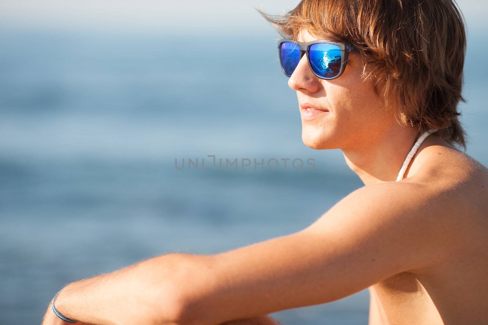 young healthy beautiful men portrait laughing on the beach by Lcrespi