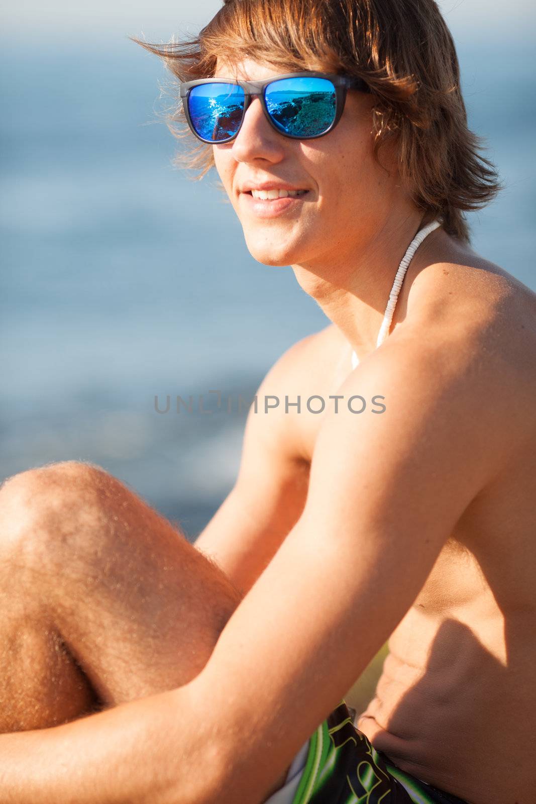 young healthy beautiful men portrait laughing on the beach by Lcrespi