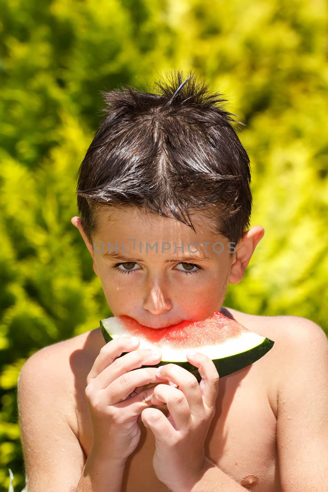 wet boy with watermelon in the garden by artush