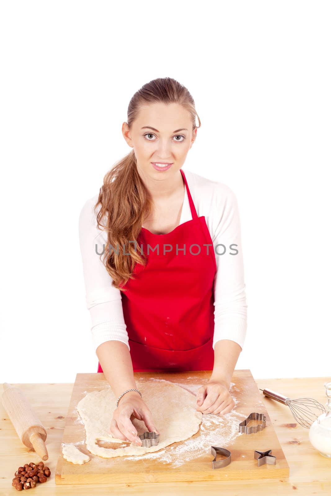 beautiful woman is baking cookies for christmas isolated