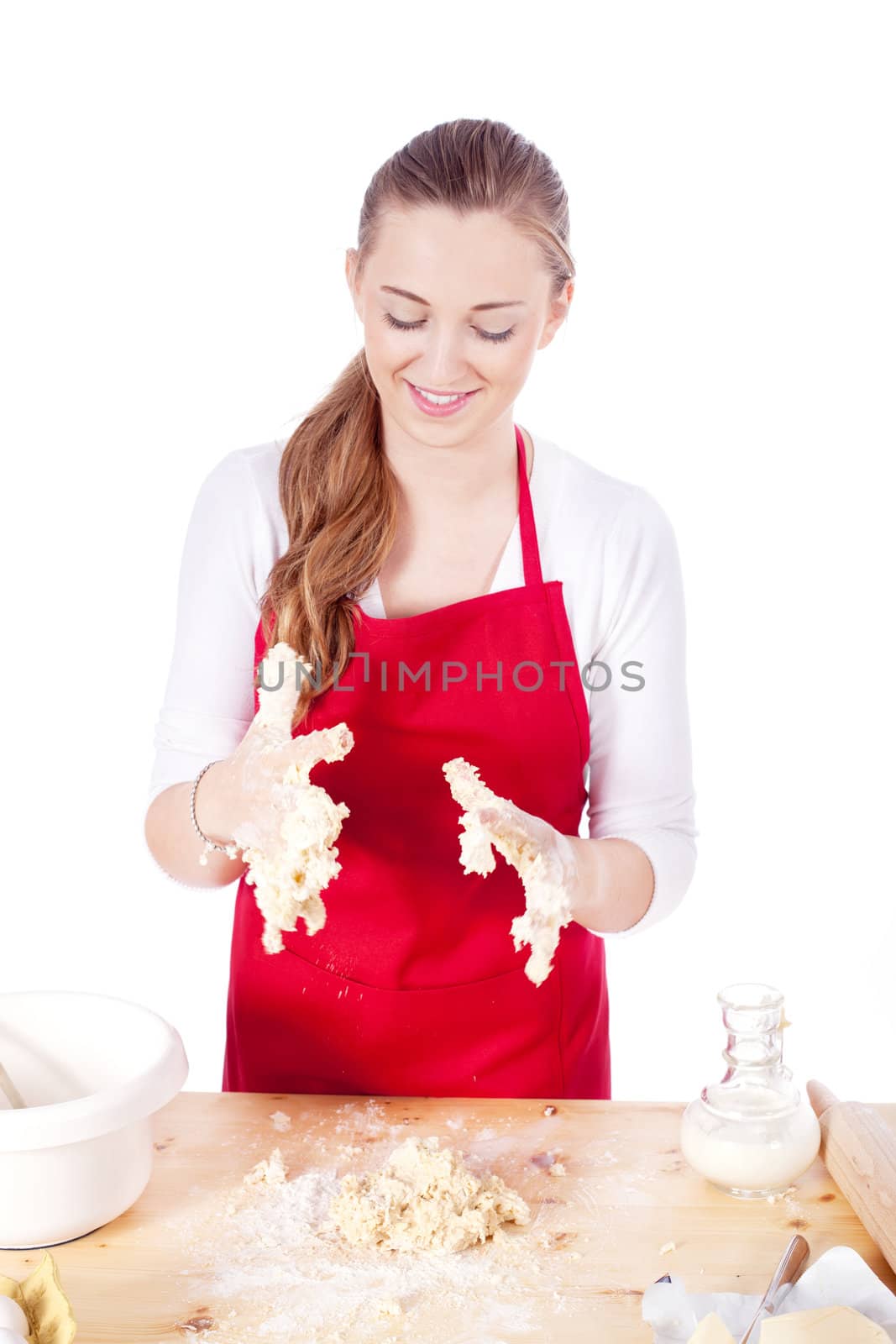 beautiful woman is baking cookies for christmas by juniart