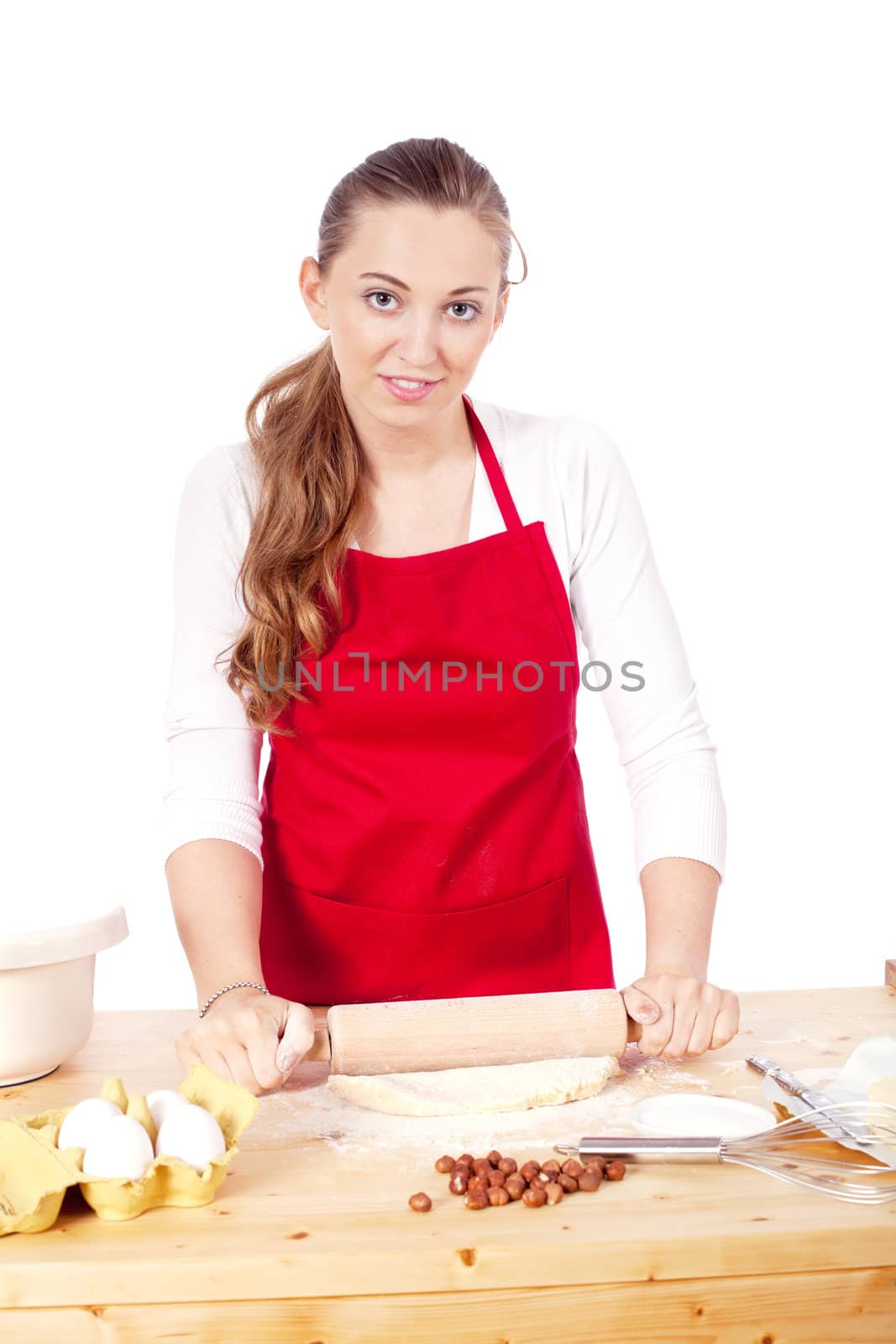 beautiful woman is baking cookies for christmas by juniart