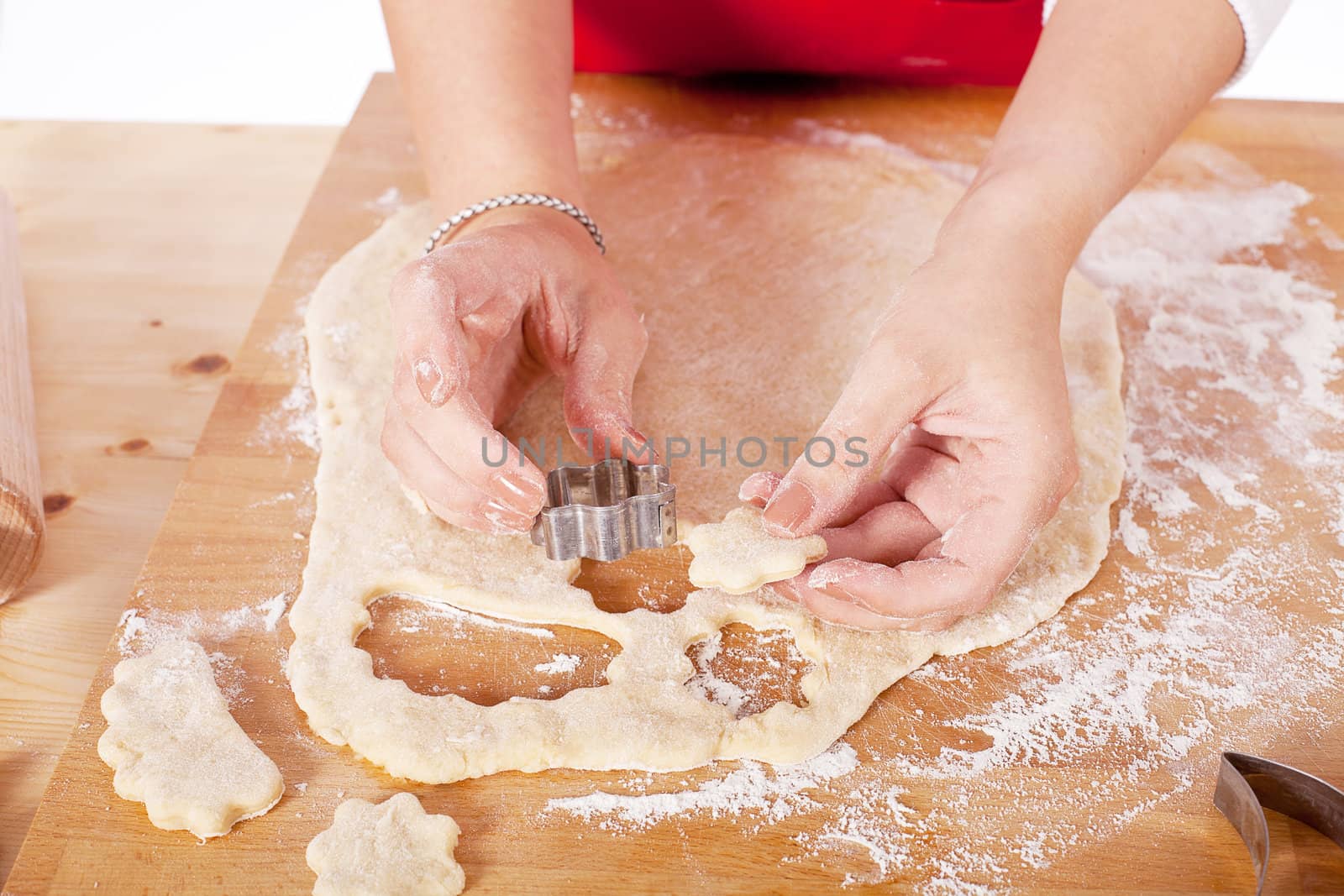 beautiful woman is baking cookies for christmas isolated