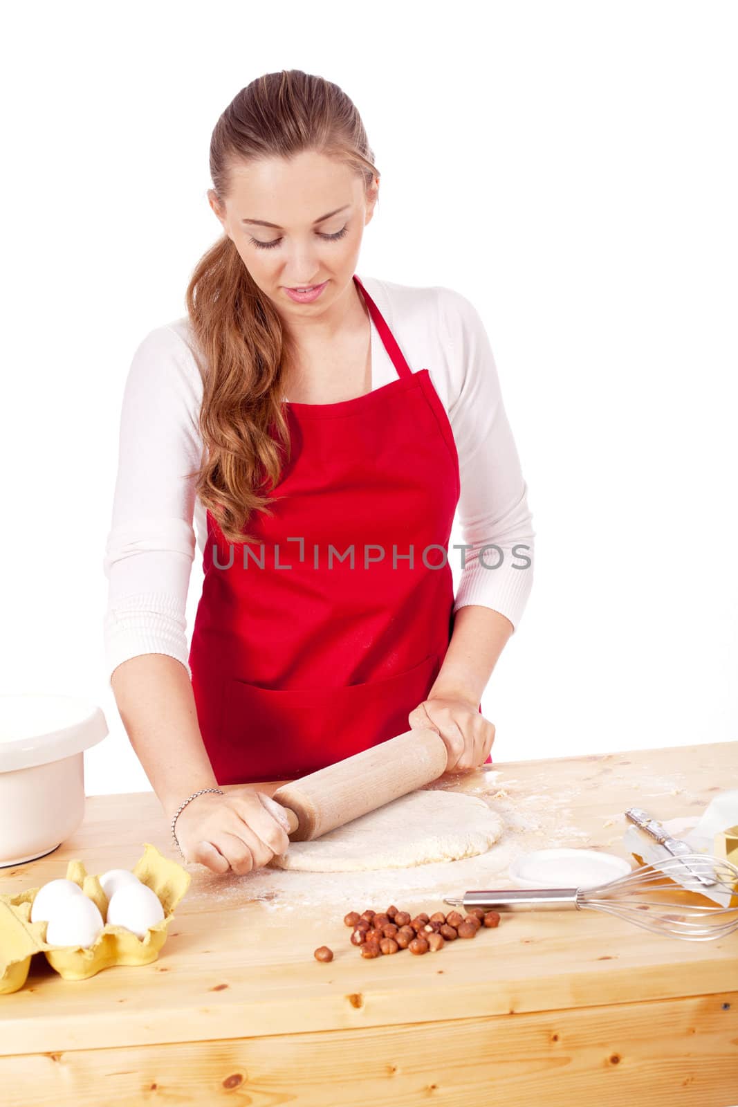 beautiful woman is baking cookies for christmas isolated