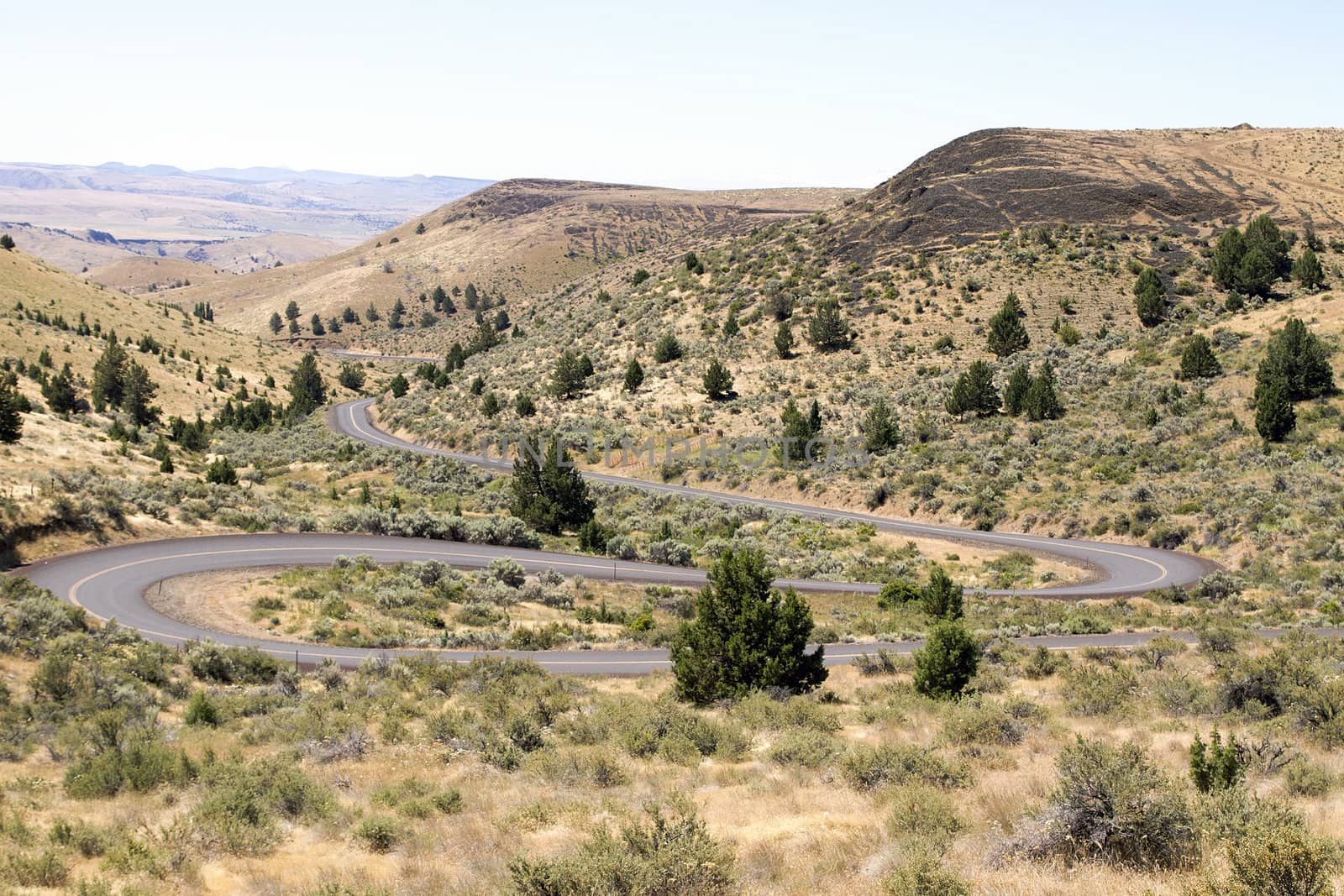 Winding Highway in Oregon High Desert Farmland by jpldesigns