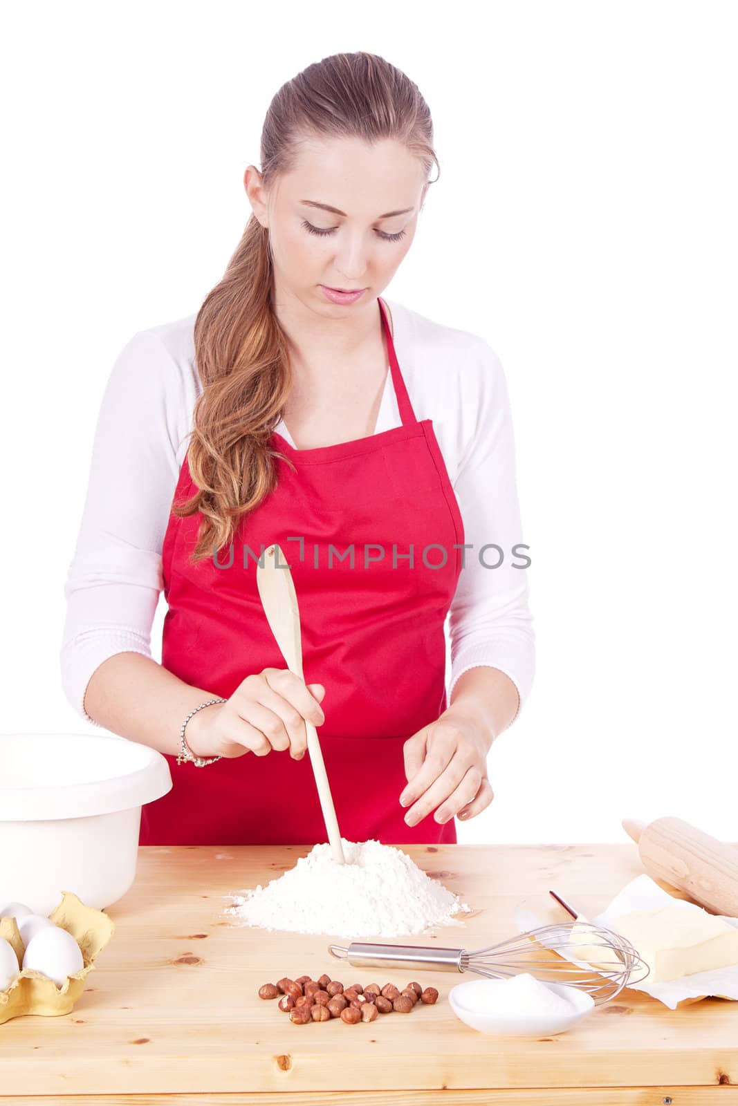 beautiful woman is baking cookies for christmas isolated