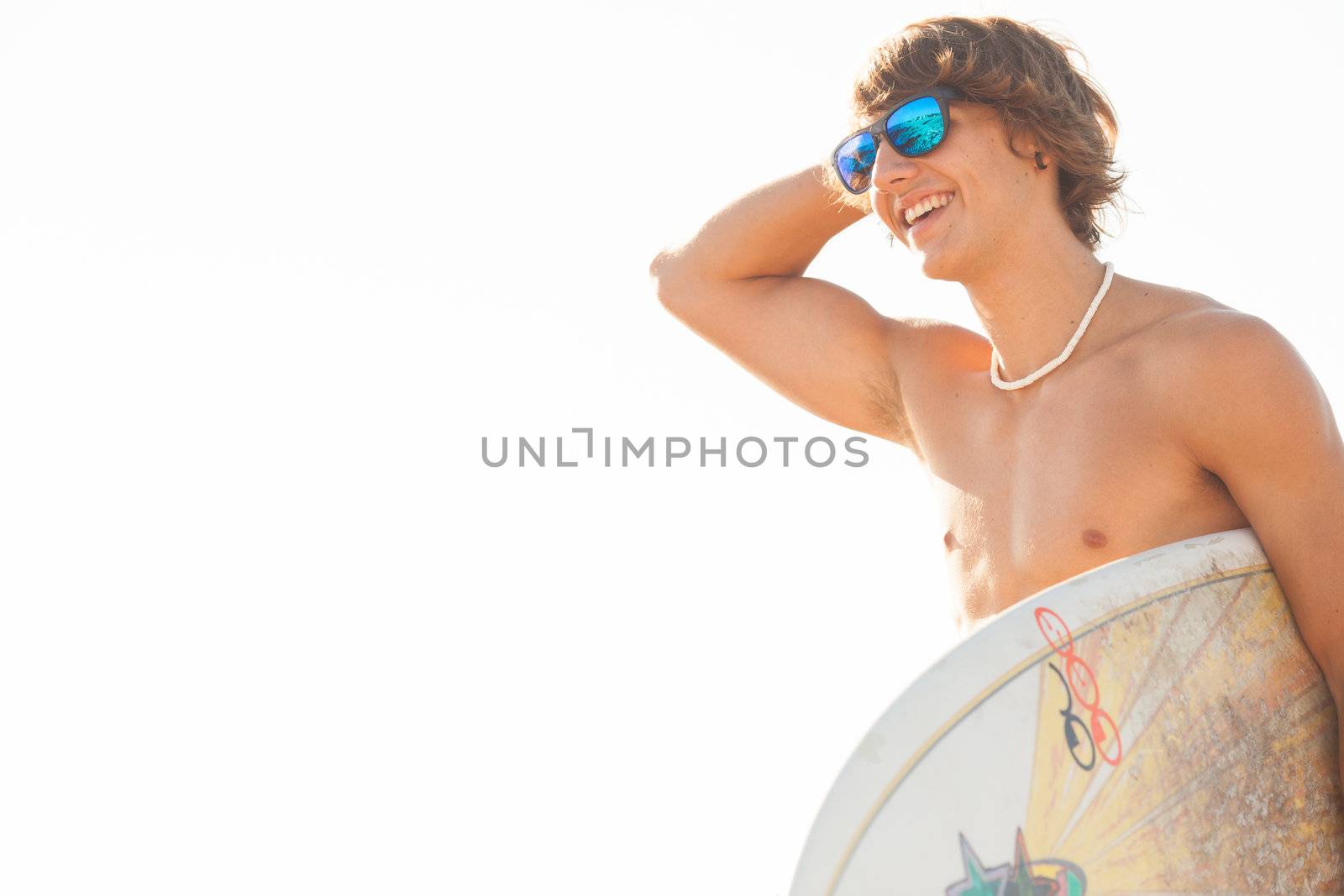 young surfer about to get into the sea by Lcrespi