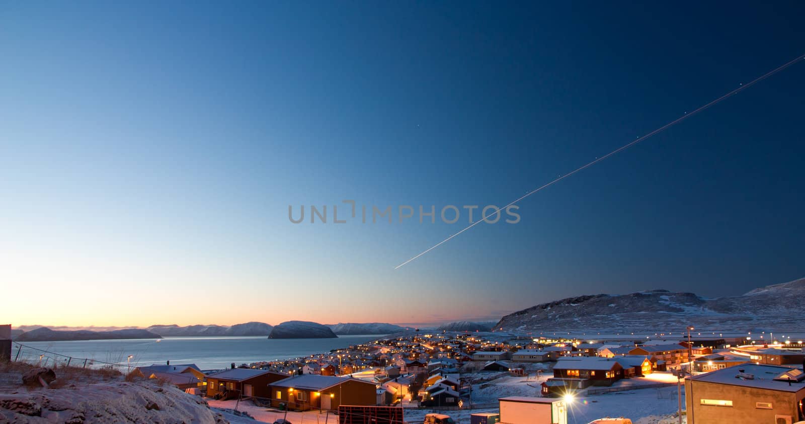 Picture of a part of the  northermost city in the world, Hammerfest. The sun is just in the horizon during day time