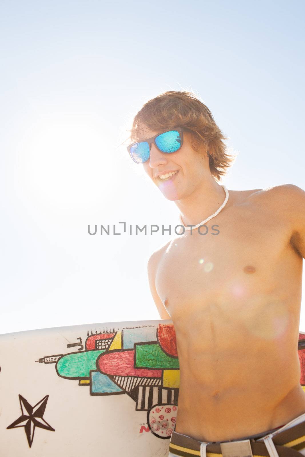 young surfer about to get into the sea