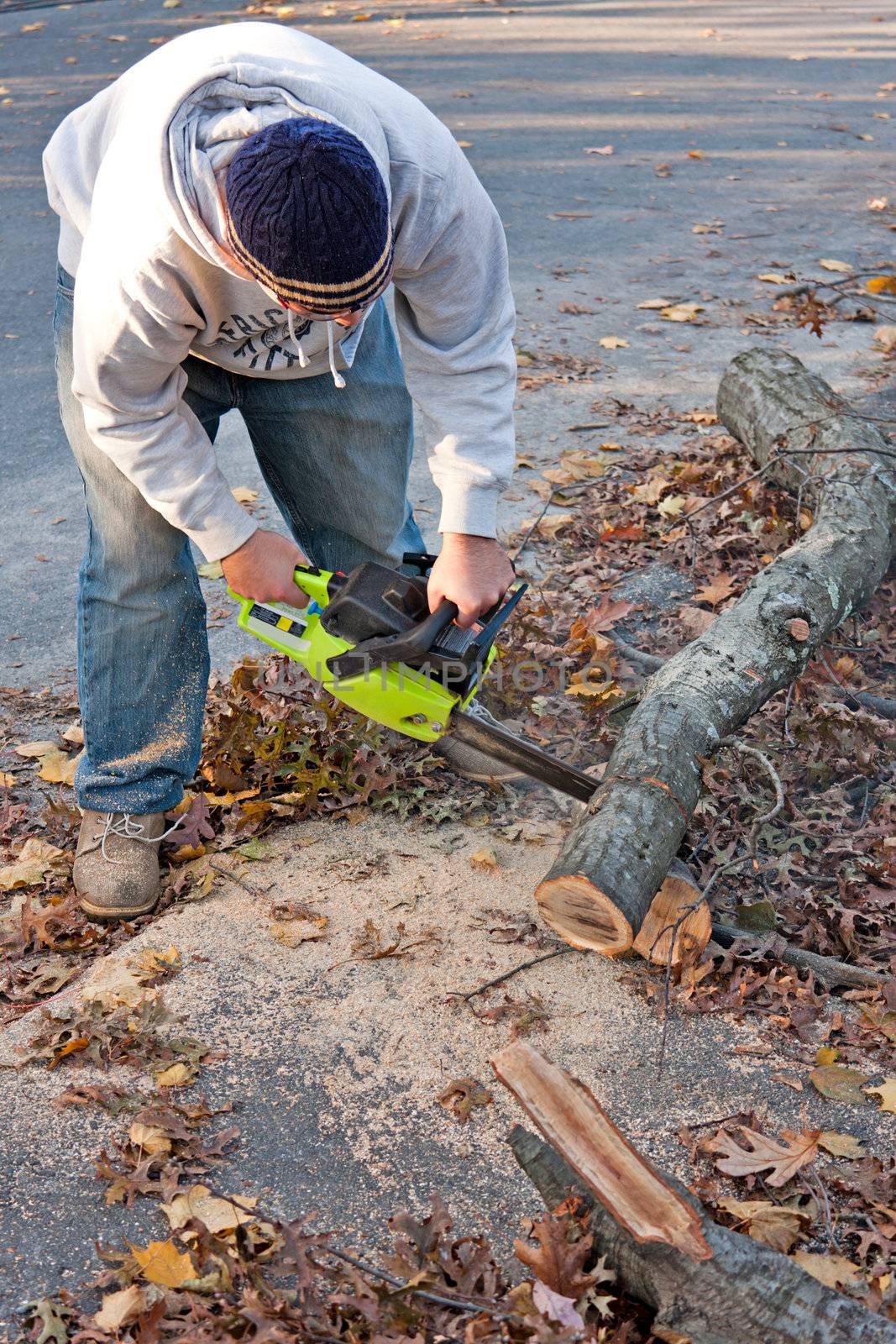 Cleaning Up Storm Damage with a Chainsaw by graficallyminded