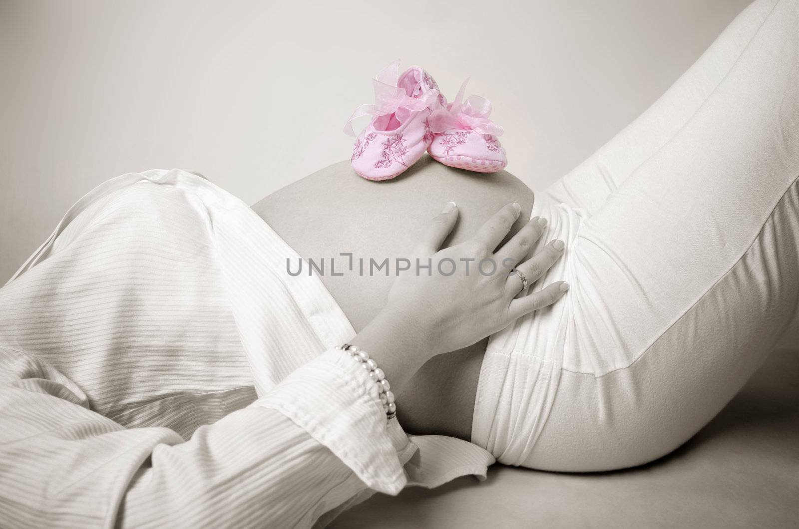 Pink shoes on mummy stomach