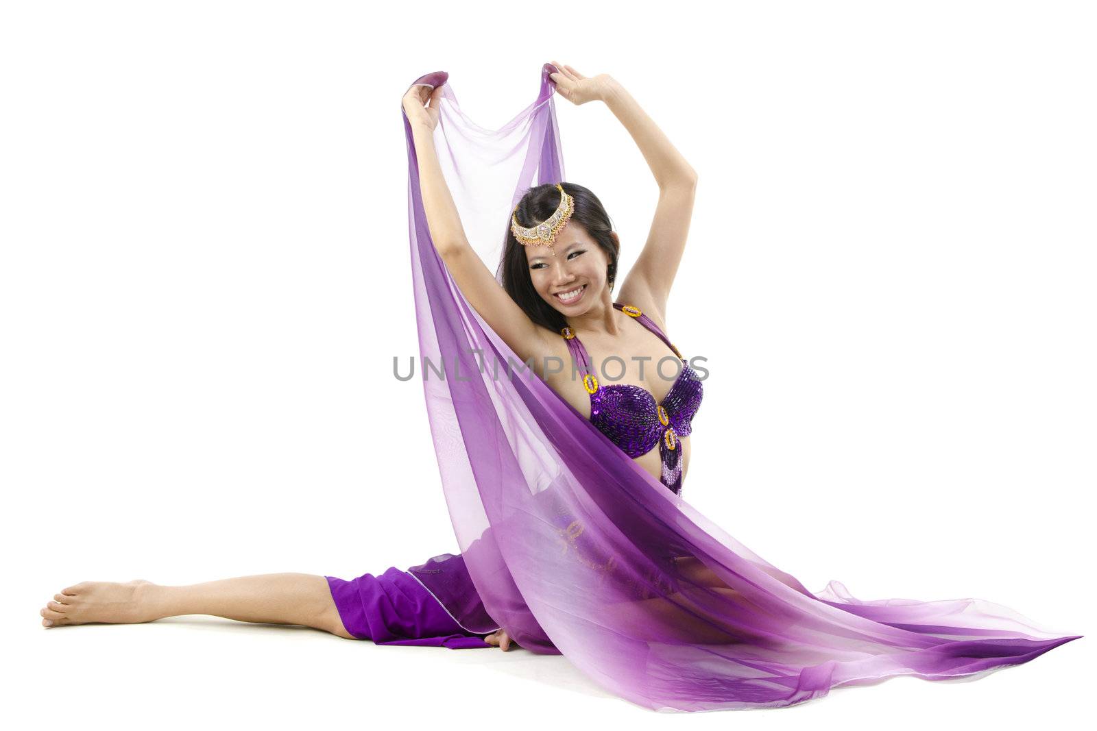Belly dancer dancing on floor, white background