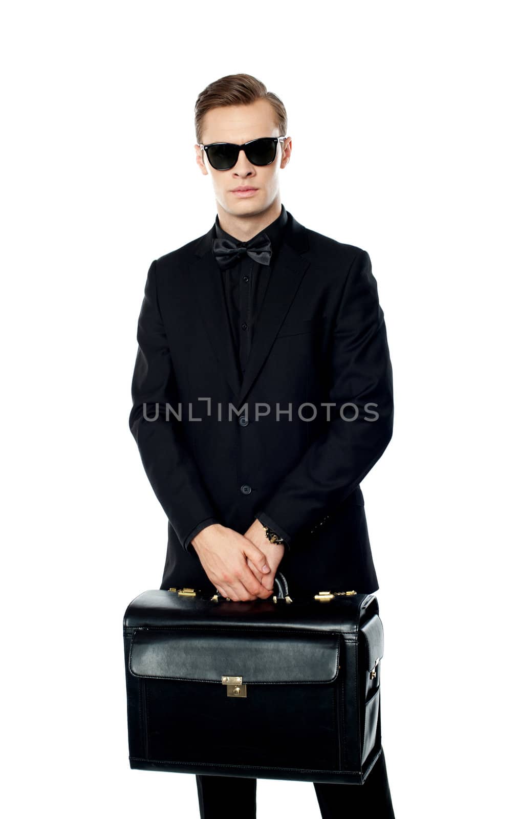 Young man carrying briefcase and wearing sunglasses