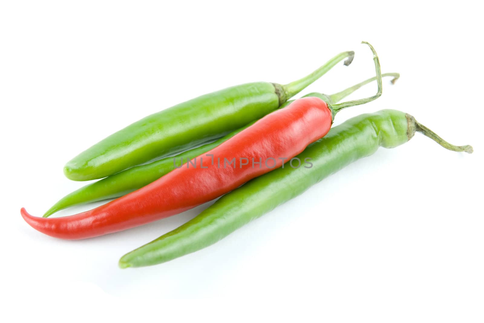 red and green hot chili peppers isolated on white