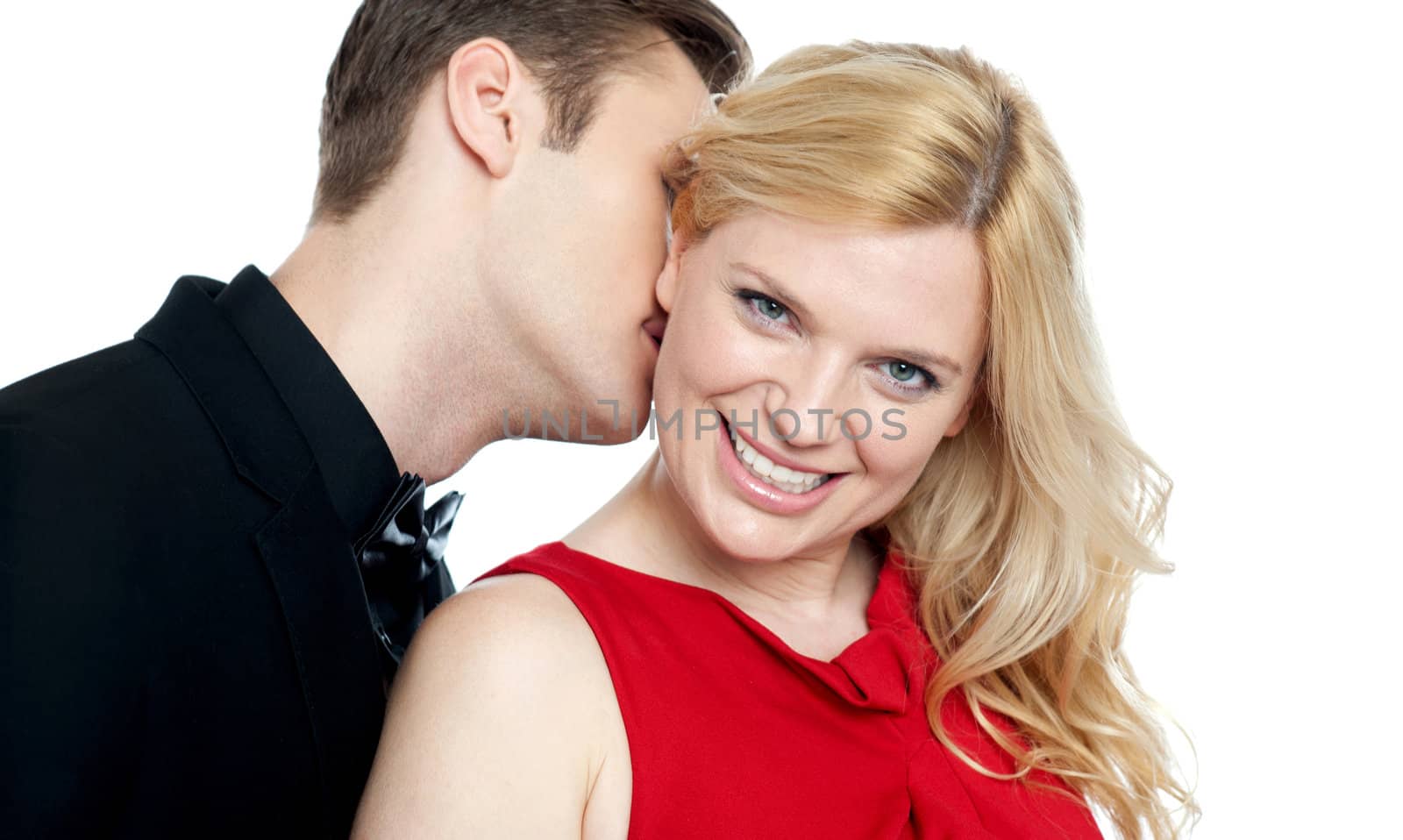 Closeup of young man kissing his lovers neck. All on white background