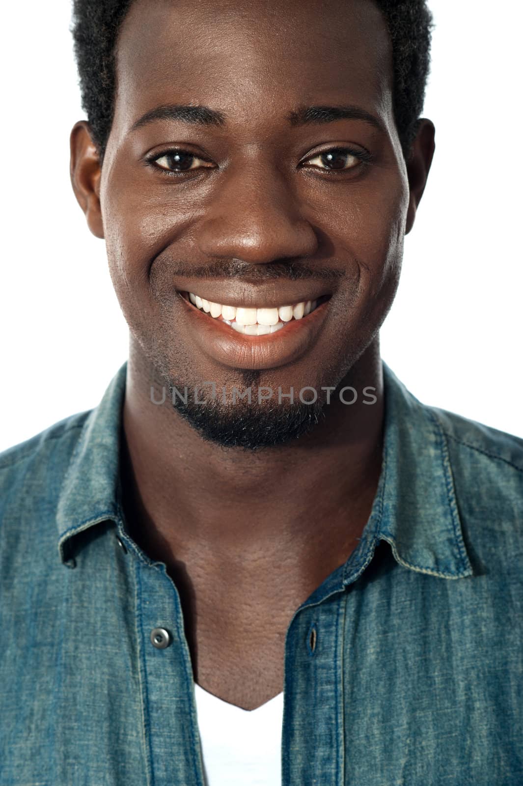Closeup portrait of smiling black teenager. Cropped image